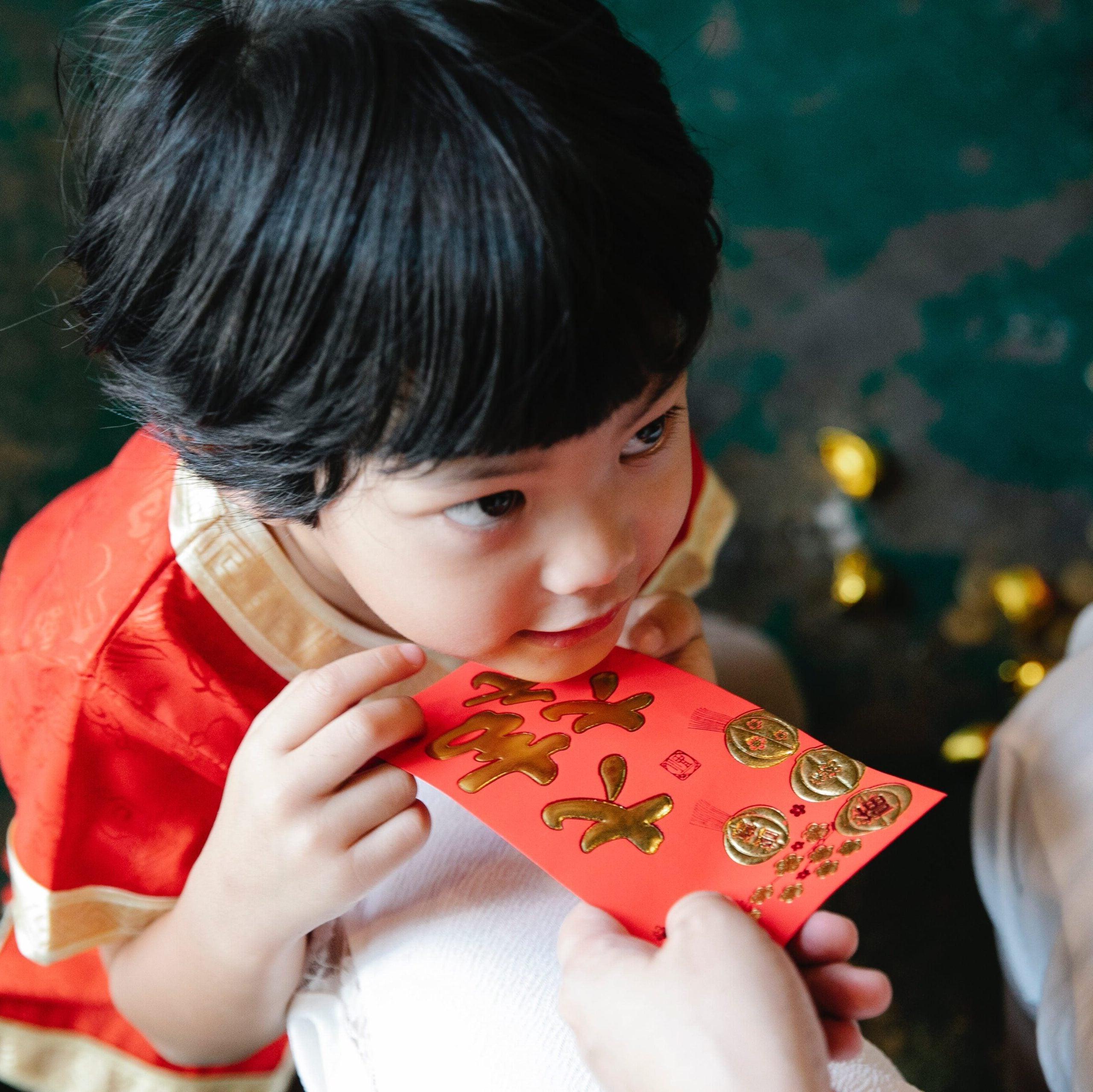 Child with money packet  during celebration